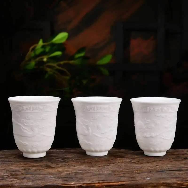Белый фарфор Dehua tea Master Cup кунг-фу чашка керамическая рельефная Дракон и Феникс появится, благоприятный Qi