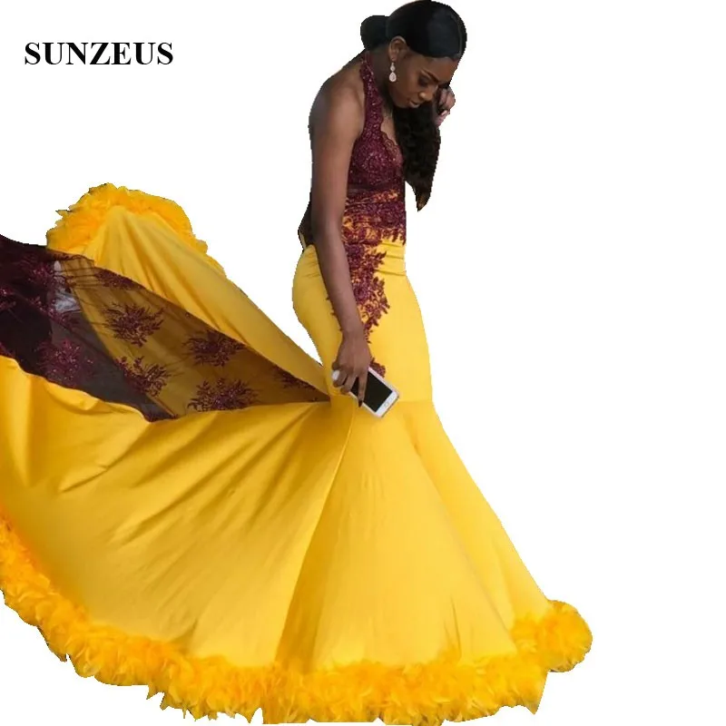 

Mermaid Gold Evening Dresses With Burgundy Apliques Lace Sexy V-neck Halter Long Party Gowns Low Back Feathers Formal Wear