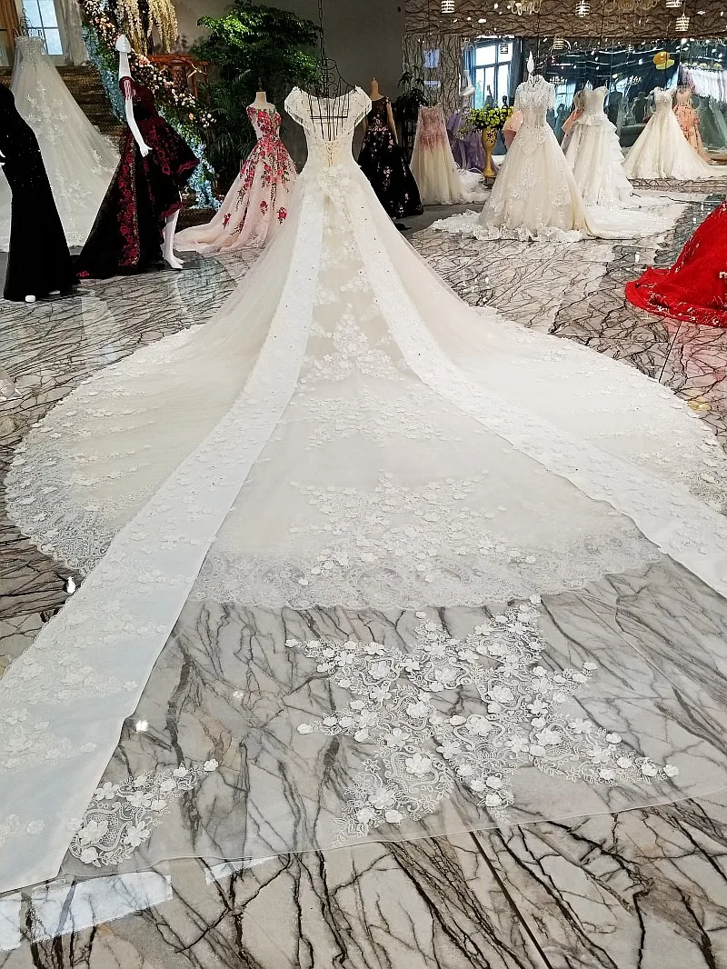 LS00302 свадебное платьебез спинки крышка рукава большой лук назад кружева бальное