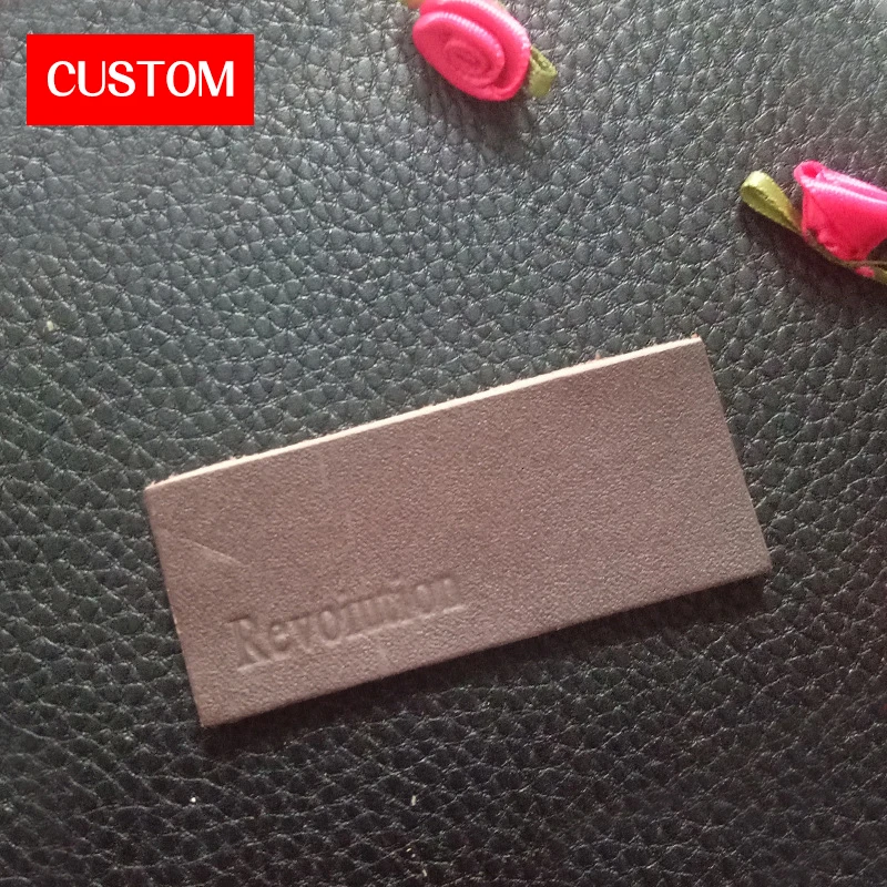 

factory private customzied PU leather embossed labels sewing on clothes private label branding for jeans leather garment labels