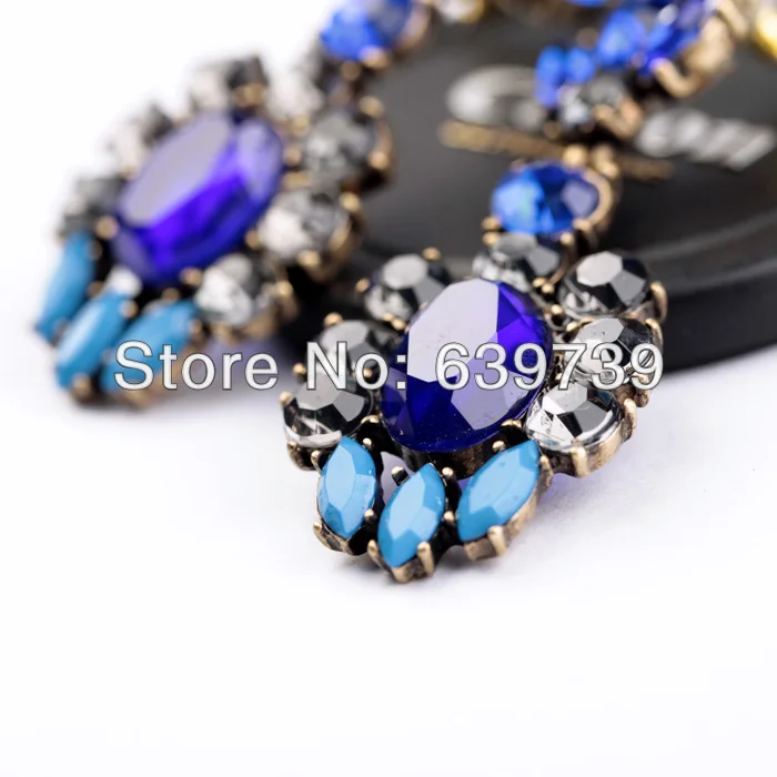 Винтажные антикварные серьги из разноцветной смолы золотого цвета по оптовой