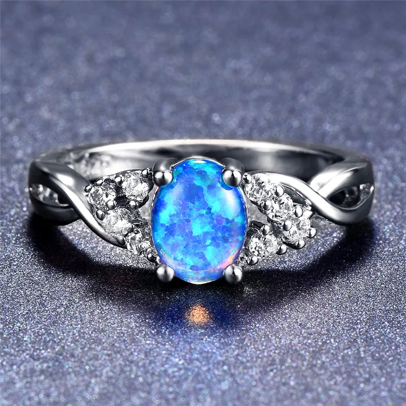 Женское кольцо из белого золота 14 карат с овальным покрытием синее/фиолетовое