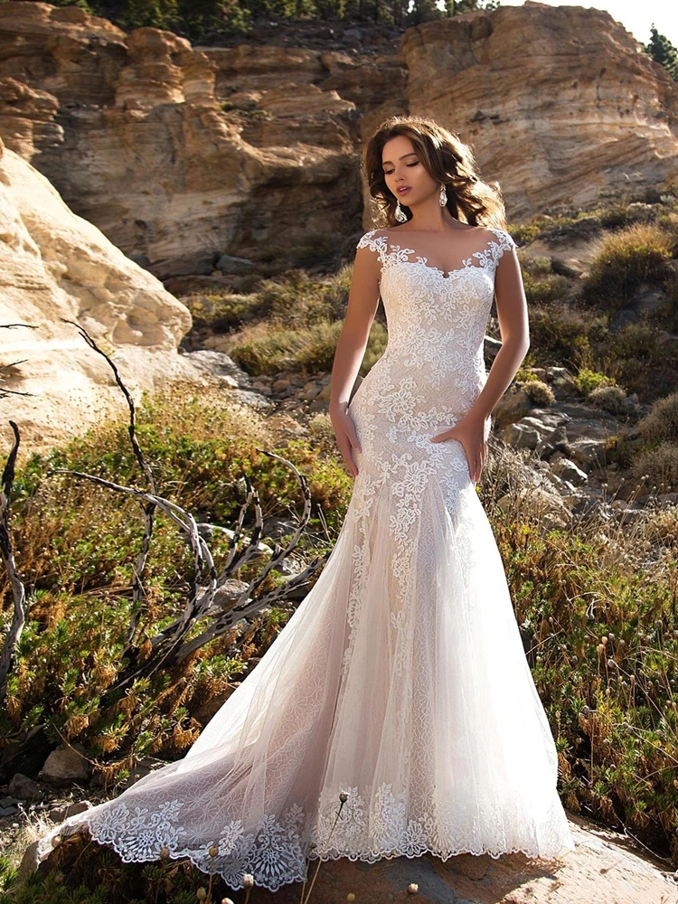 

Elegant Lace Mermaid Wedding Dresses Sheer Cap Sleeves Lace Applique Sweep Train Wedding Bridal Gowns With Buttons
