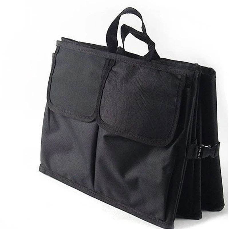 board organizer

Автомобильный органайзер для багажника с карманами для хранения инструментов и перчаток, выполненный из холста.