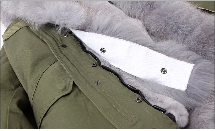Женская парка на искусственном меху зеленая с воротником из натурального