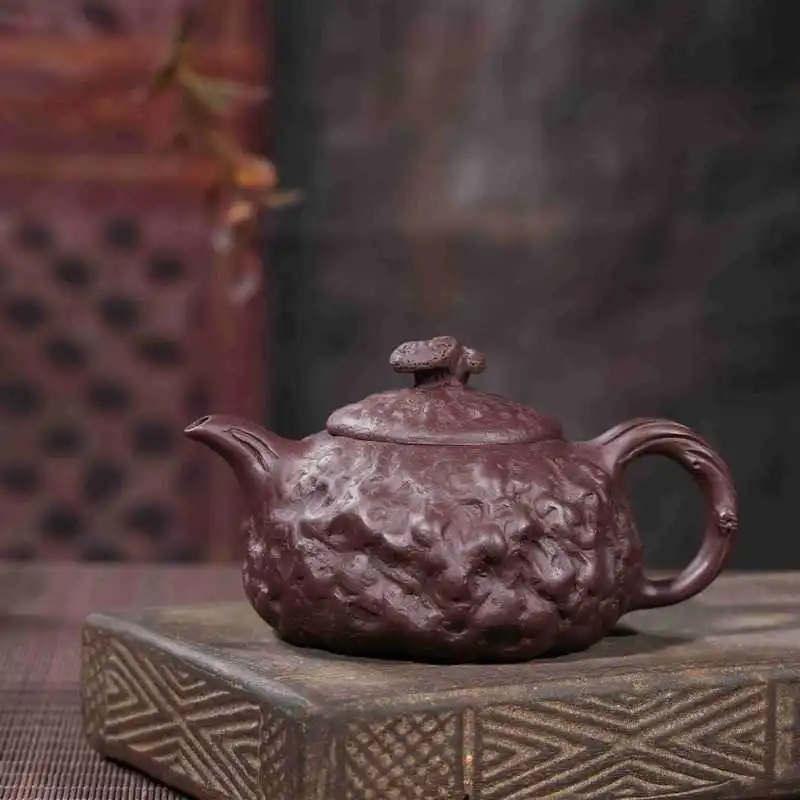 

Gong Chun pot of traditional manual undressed ore painted purple mud carved the teapot tea wholesale gift manufacturer