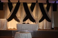 white wedding backdrop with black swags and silver sequin luxury wedding decoration