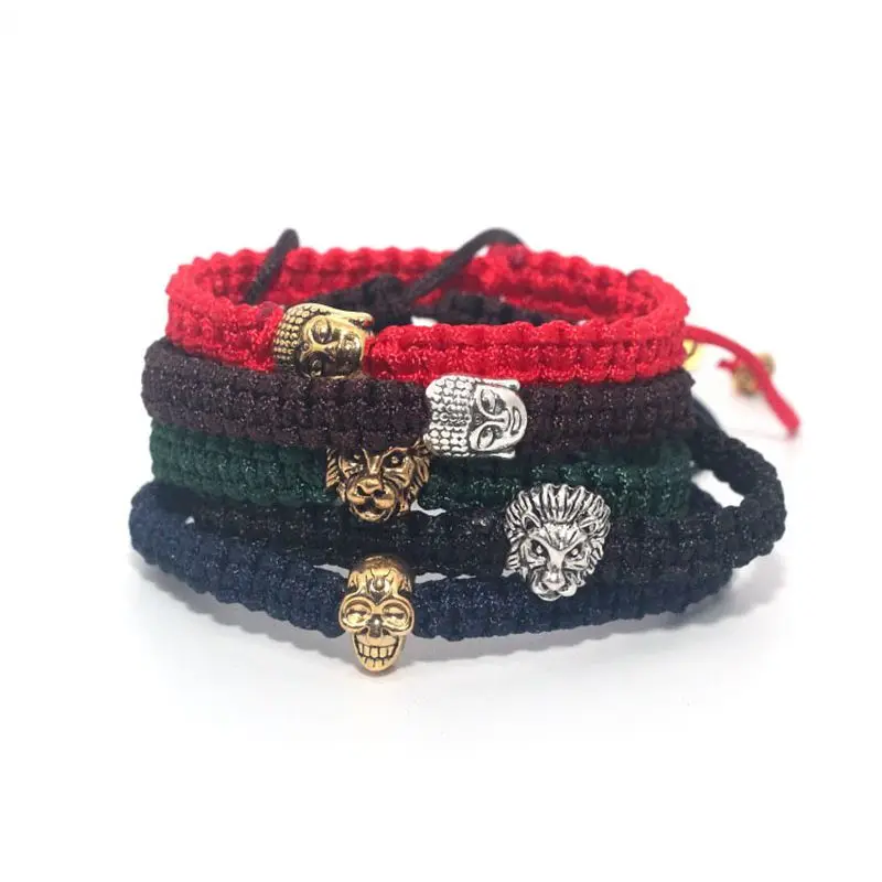 Мужской браслет макраме из черного веречка с серебряным и золотым черепом львом