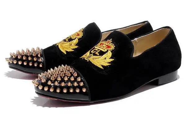 black loafers with gold spikes
