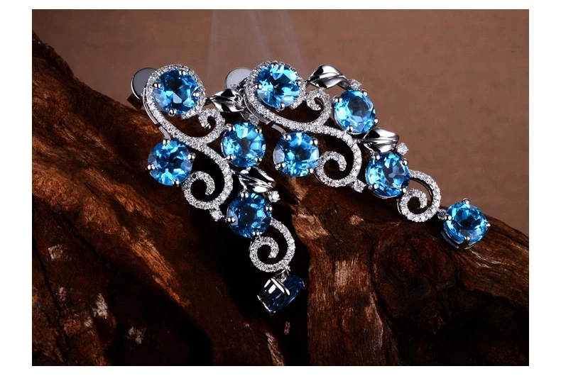 Белое золото 750 карата с натуральным голубым топазом и бриллиантами полной