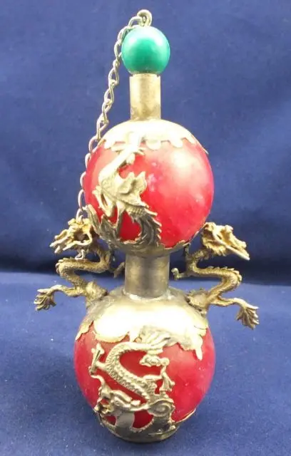 

Chinese Tibetan silver Dragon and Phoenix Artificial Red Jade snuff bottle
