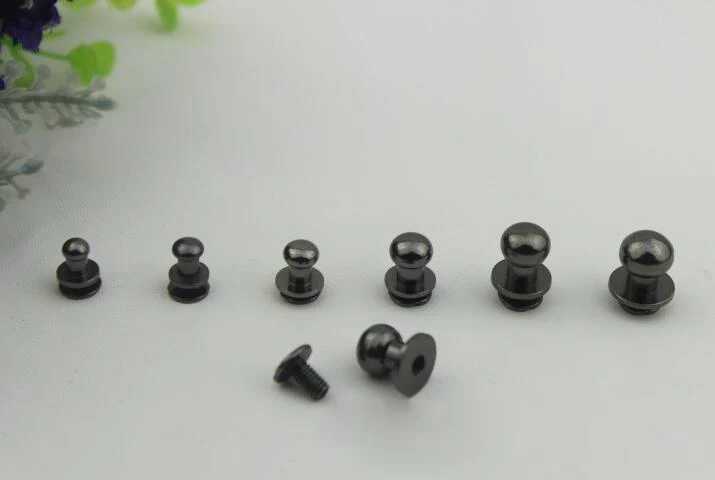 100 шт./лот Черные металлические аксессуары для сумок высокого качества с толстым боковым щитком, фиксатором для пустышки и винтовыми креплениями для ремней багажа.