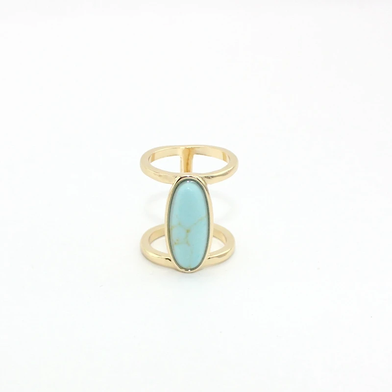 Женское кольцо с натуральным камнем howlite золотого цвета овальным белым и зеленым