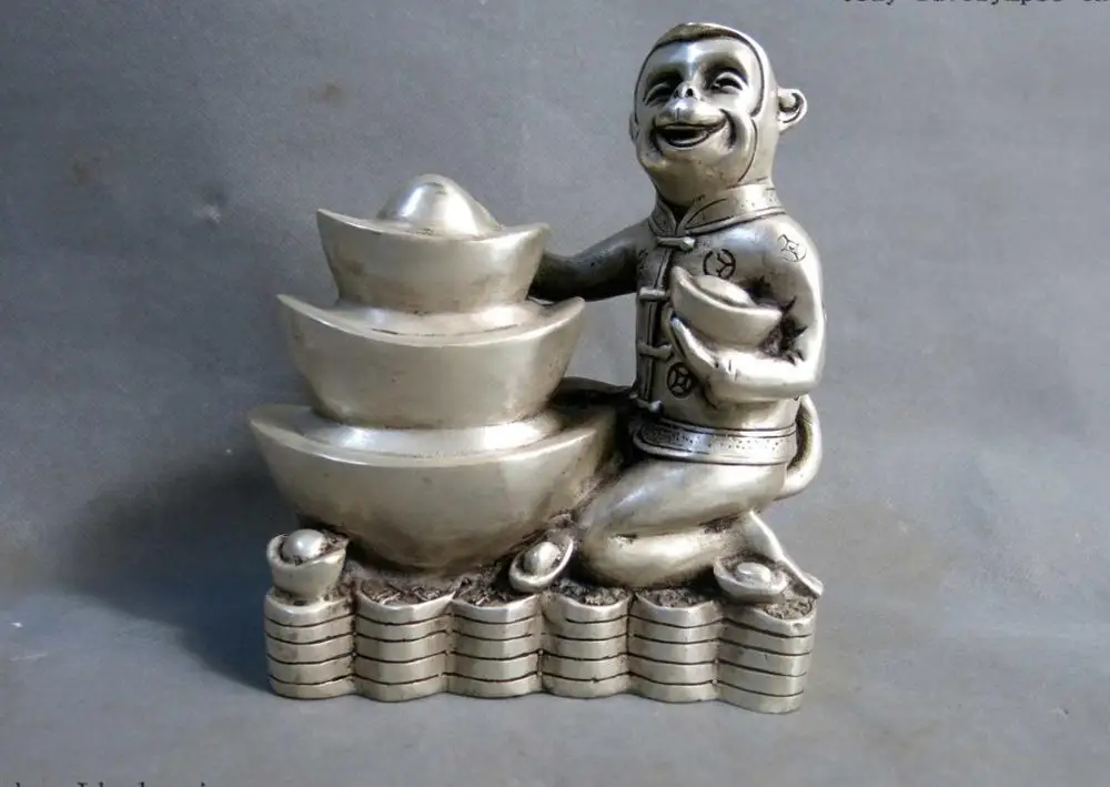

China silver carved fine sculpture Yuan Bao money luck monkey statue