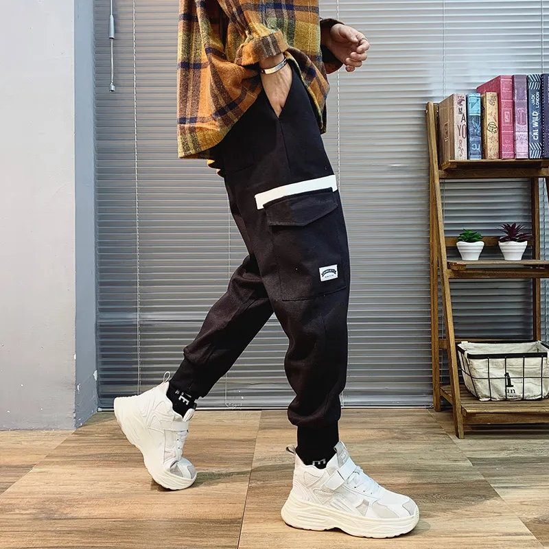 

Net red pants male Korean version of the trend of the foot casual nine points sports pants students loose wild overalls men's ti