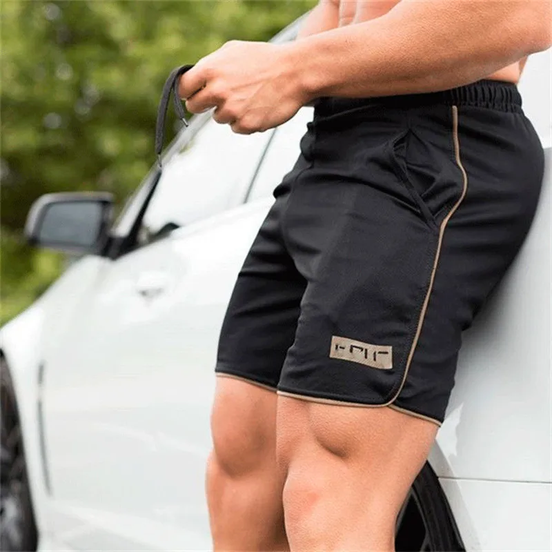 

Summer men sports shorts fitness quick-drying breathable running shorts mens Casual Solid color thin loose tie Beach Shorts