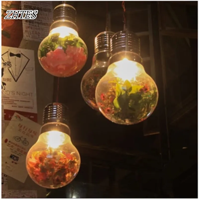 Растение в кофейне с большой лампочкой подвесной светильник из зеленого стекла