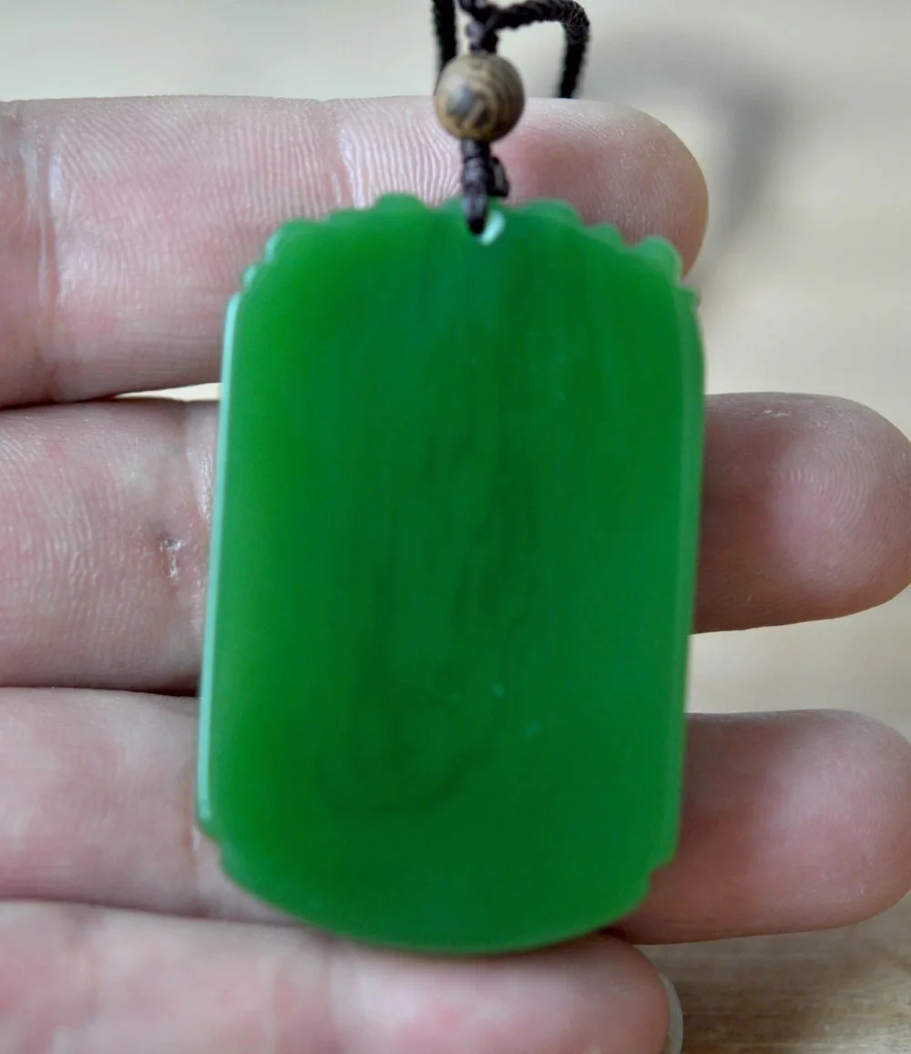 

Chinese Rich Green Natural Hand-Carved HeTian Jade Dragon pendant