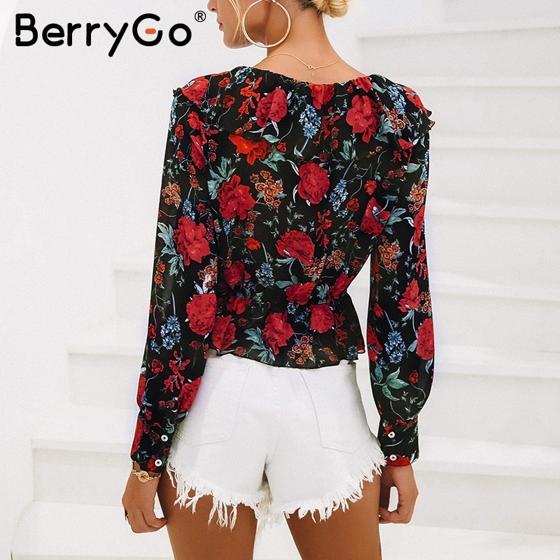 Женская блузка в горошек BerryGo красная с v образным вырезом и цветочным принтом