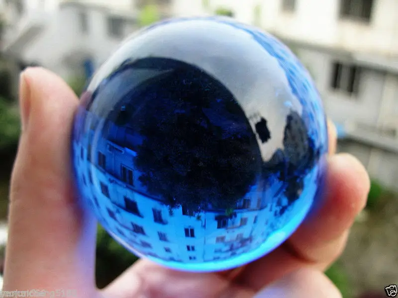 

The hot 60MM blue glow white jade glows in the dark stone ball