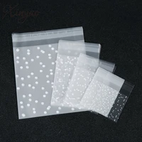 xinyao 100pcslot white dots plastic christmas gift bag opp birthday party wedding cookie candy bag