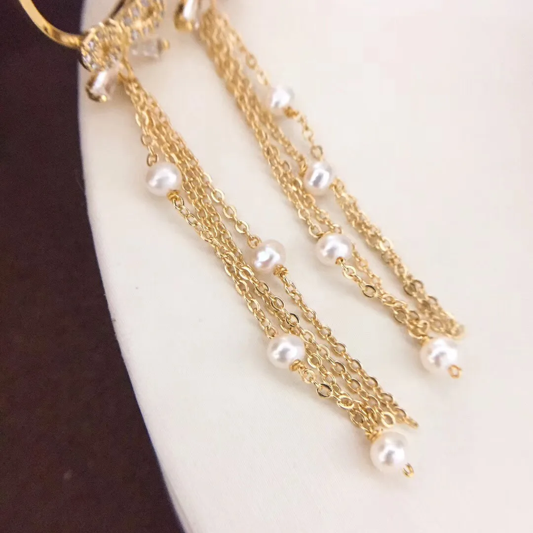 14k обратите внимание что серьги с кисточками и бантом из золотого материала тают