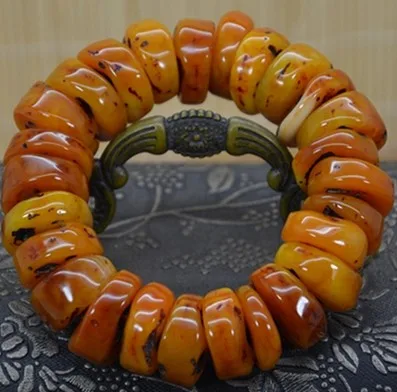 

Amber beeswax beads bracelet with the hand prayer beads