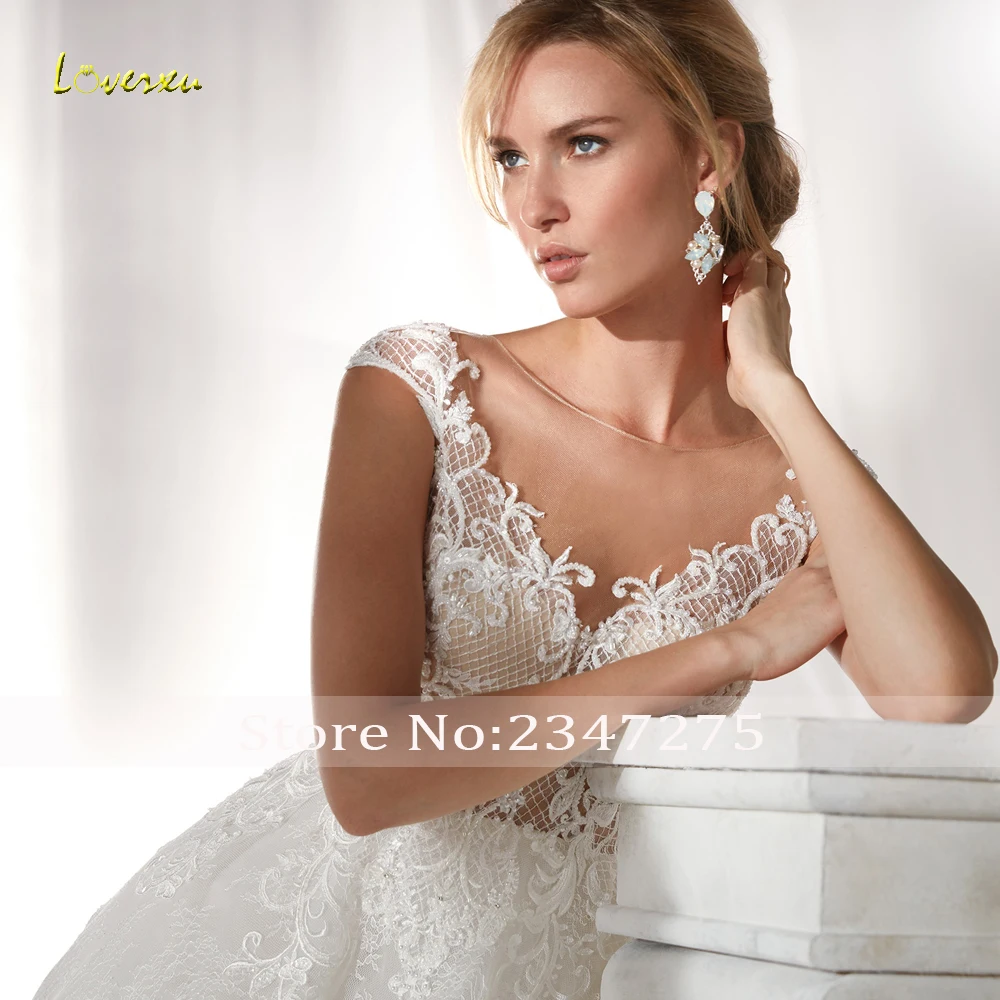 

Loverxu Sexy Illusion Pearls Lace Vintage Wedding Dresses 2019 Luxury Cap Sleeve Appliques Beaded Court Train A Line Bridal Gown