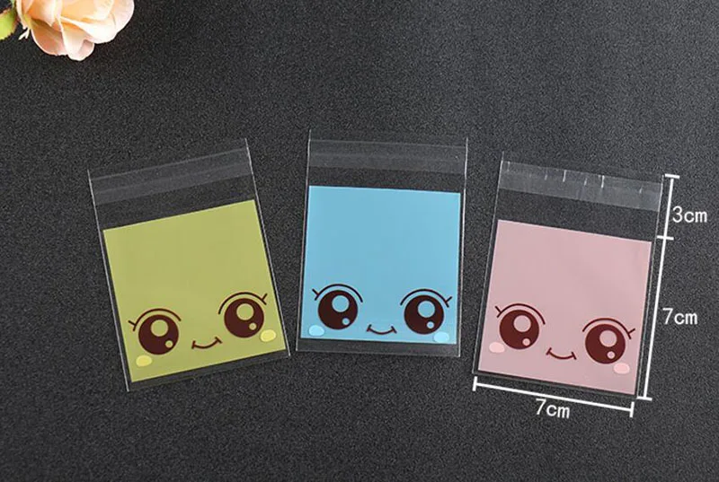 Сумка для упаковки конфет с рисунком большие глаза девочек 100 шт. 7*10 см