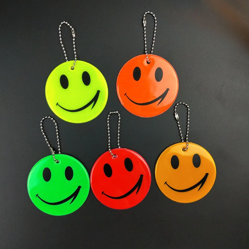 

Wholesale 100pcs smile face Reflective keychain bag pendant accessories High visibility keyrings for traffic visible safety use