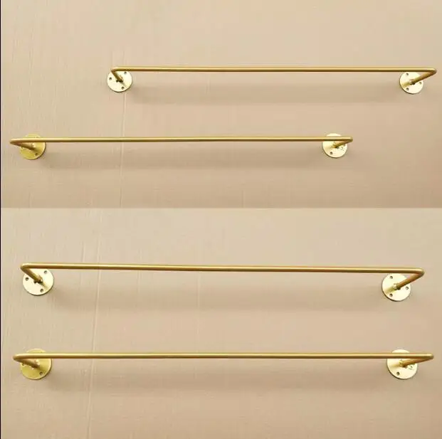 Gold clothing store display rack wall - mounted thin tube clothes rack