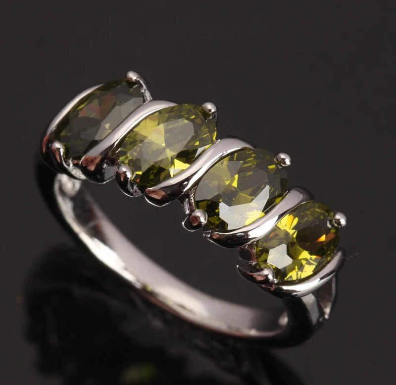 Элегантное серебряное кольцо в форме четырех яиц зеленого оливкового перидота и