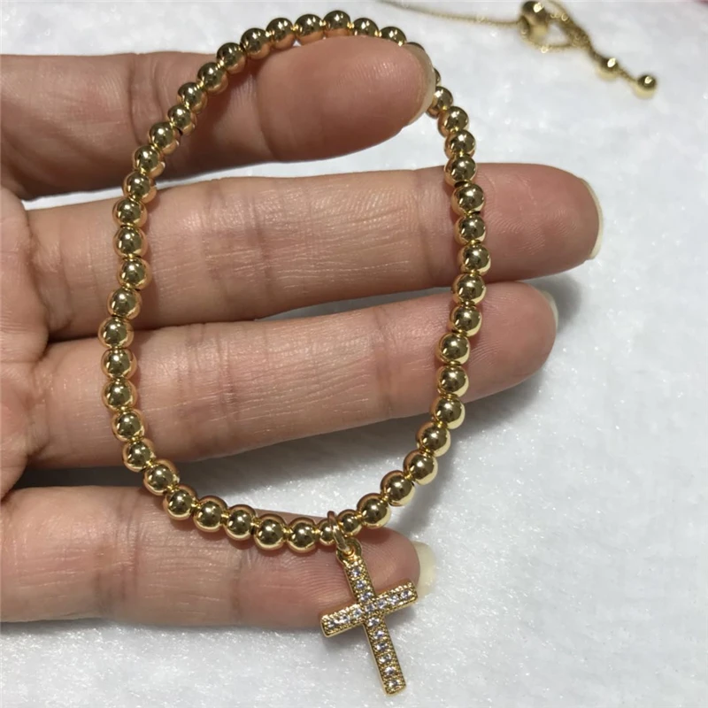 

wholesale Beautiful popular good quality inlay zirco cross 4 mm round bead bracelet Elastic rope