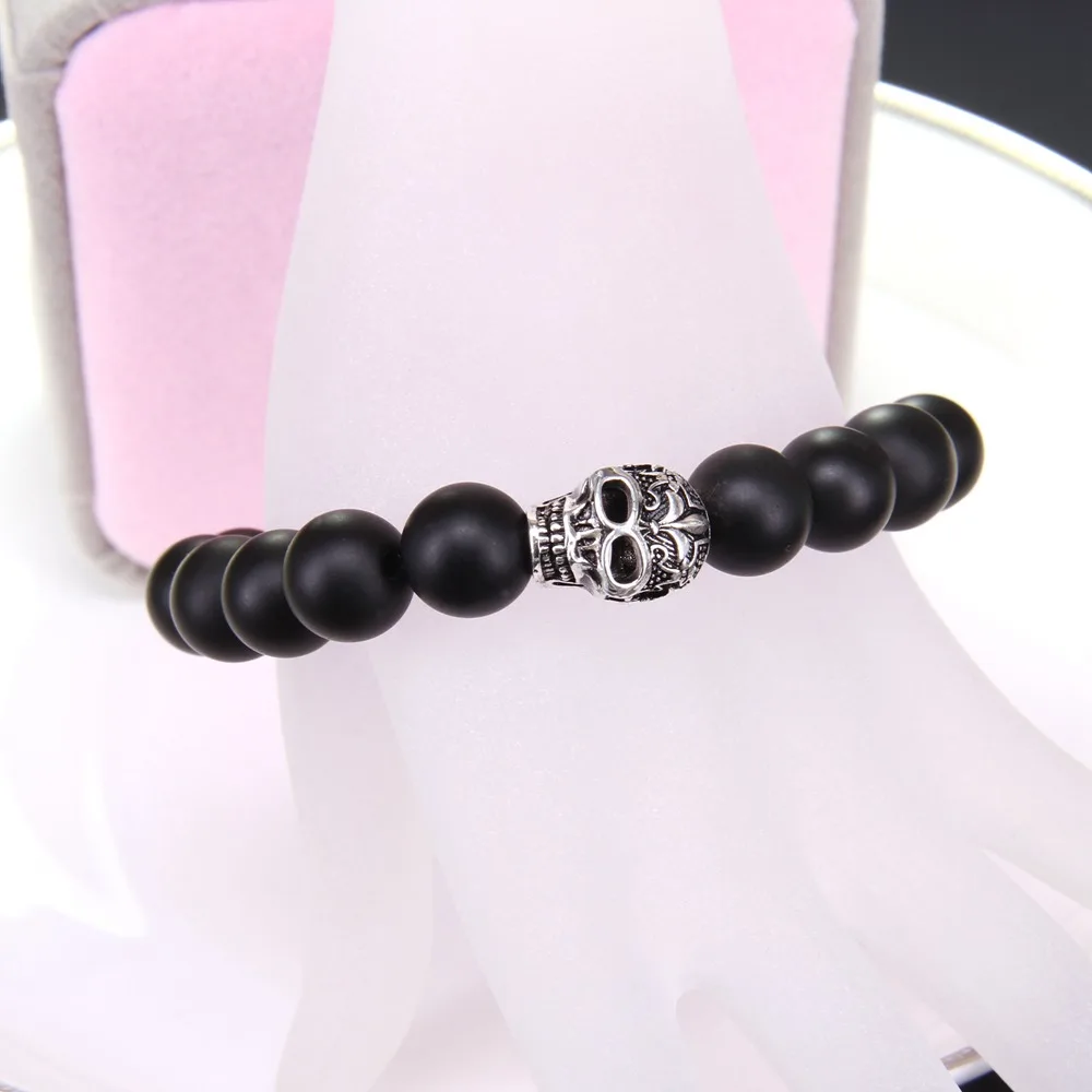 Большой черный обсидиан и череп в стиле Томаса с бусинами виде лилии эластичный