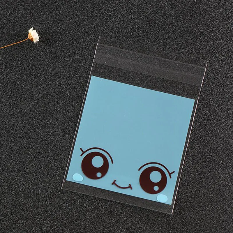 Сумка для упаковки конфет с рисунком большие глаза девочек 100 шт. 7*10 см