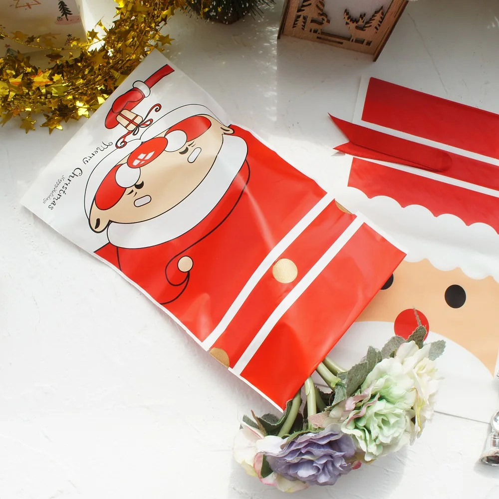

23.5*14.5cm 50pcs Red Christmas Santa Claus Elk Snowman Design Bag Christmas Party Gift Plastic Packaging Bags with Ribbon