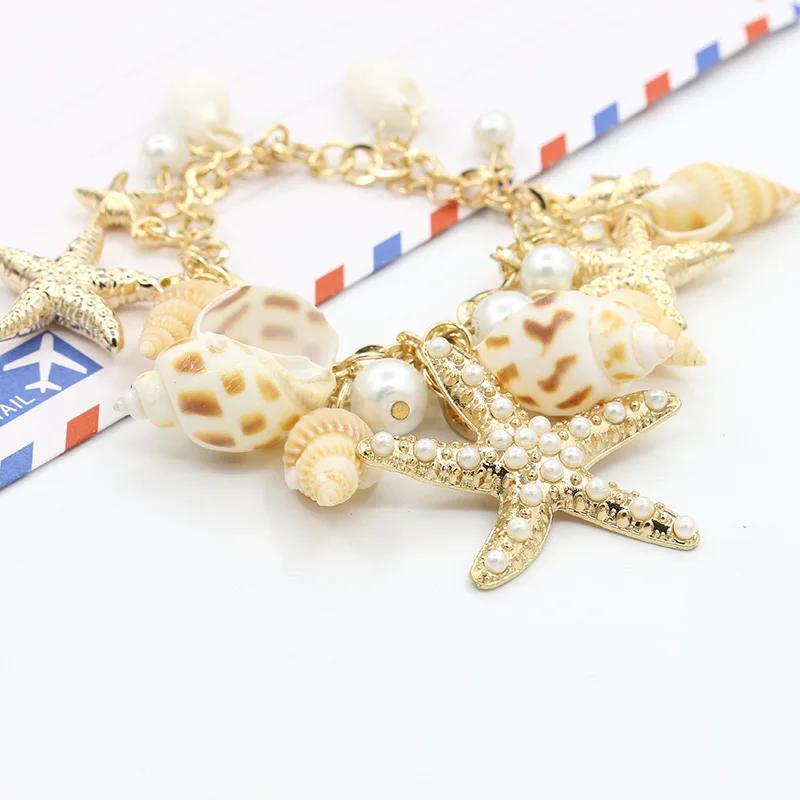 Браслет с ракушками и морскими звездами регулируемый металлический золотистый