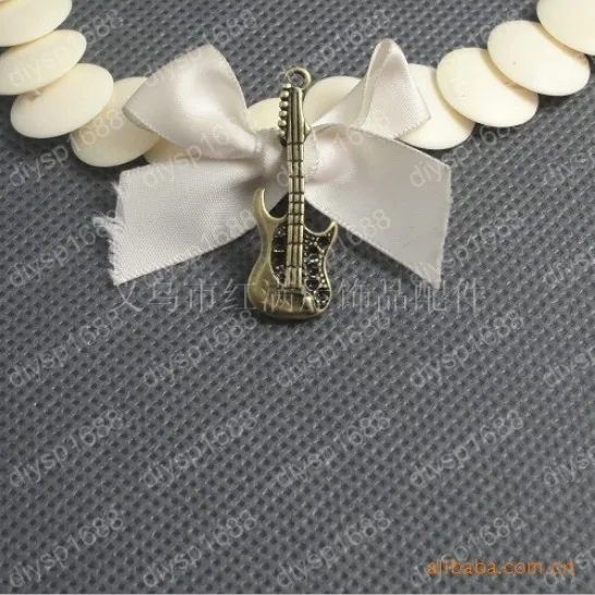 

100 pcs/lot Zinc alloy bead Antique Bronze Plated Charms Pendants Fit Jewelry38*13MM The guitar parts Shape JJA1714