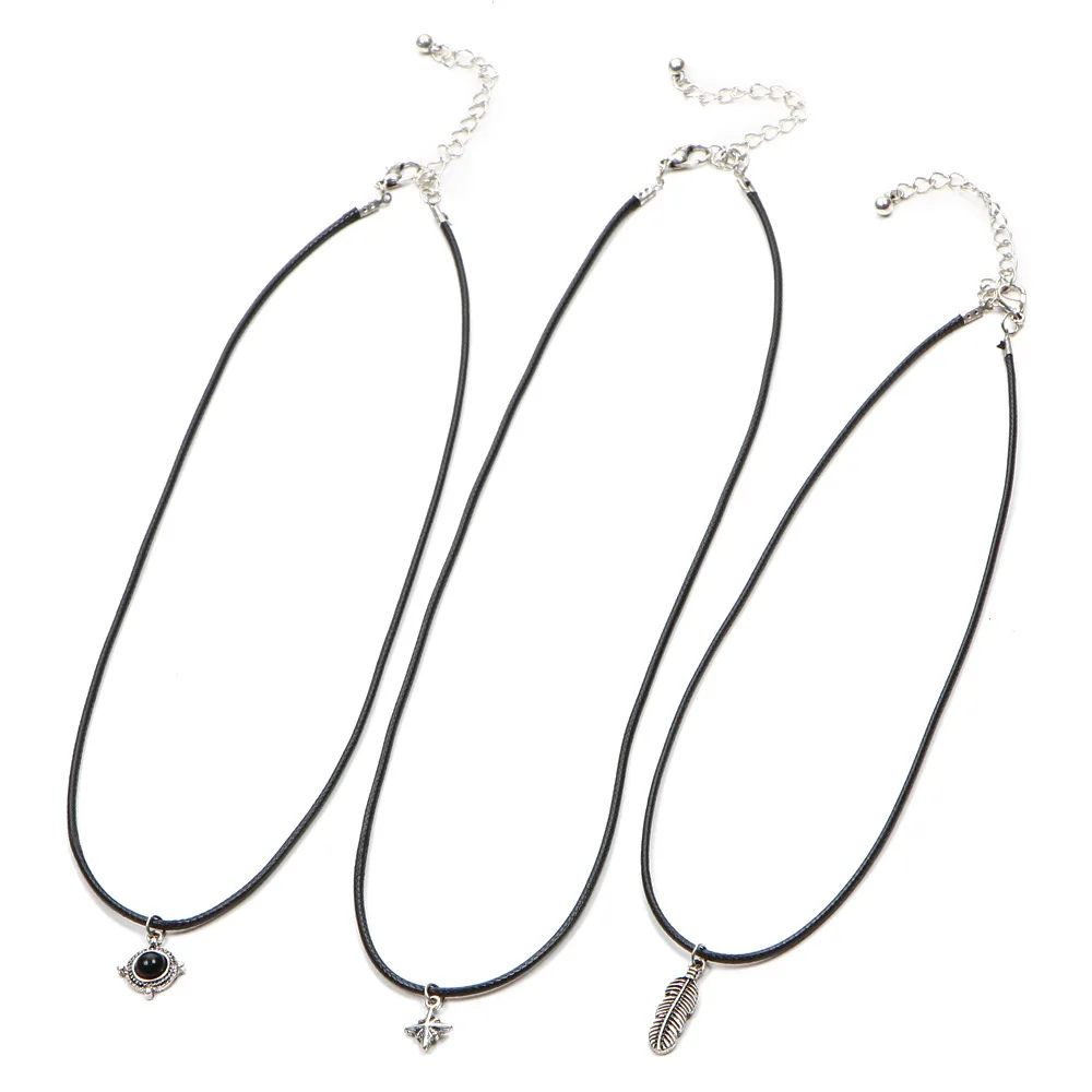 Бархатные ожерелья с перьями листьями звездами кулонами из черного камня