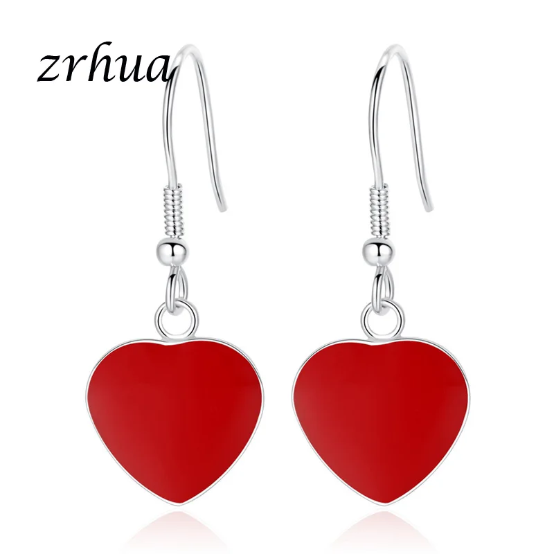 Женские серьги подвески серебряного цвета с красными