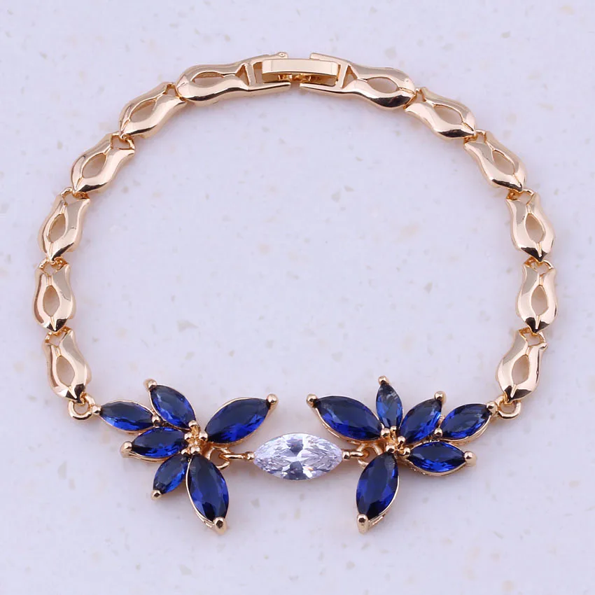 Очаровательные браслеты I0230 с голубым кристаллом и фианитом желтого золота