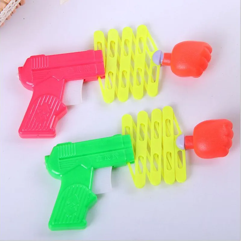 Лидер продаж дешевый выдвижной пистолет с кулаком упругая игрушка смешные