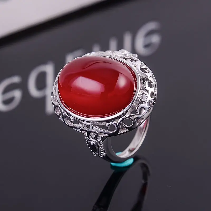 

KJJEAXCMY fine jewelry 925 Silver inlaid with natural red jade medulla ring with two colors to choose from.