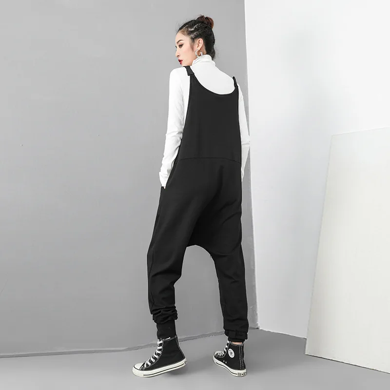 

Europe and the United States tide brand 2019 spring new print jumpsuit female dark black personality large size strap trousers