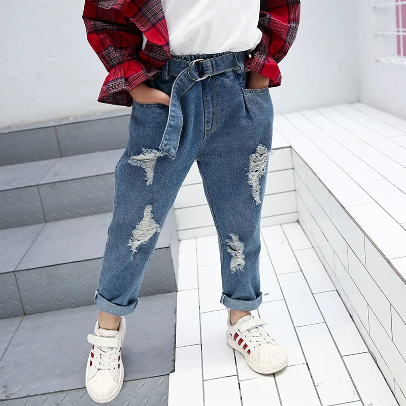 

Детские рваные джинсы с дырками, брюки для девочек на весну и осень, новинка, модные повседневные джинсовые брюки для детей, джинсы для девоч...