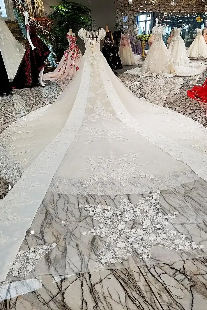 LS00302 свадебное платьебез спинки крышка рукава большой лук назад кружева бальное