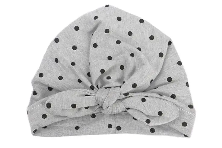 

Hot 1 pcs newborn dots baby hat fashion Bohemia Style Solid Color Rabbit Ear skullies cotton baby turban India hat with bow