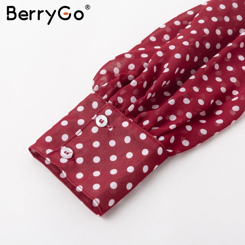 Женская блузка в горошек BerryGo красная с v образным вырезом и цветочным принтом