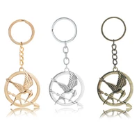 the hunger games keychain popular vintage style birds charm golden snitch pendent key chain keyrings metal keychains car holder