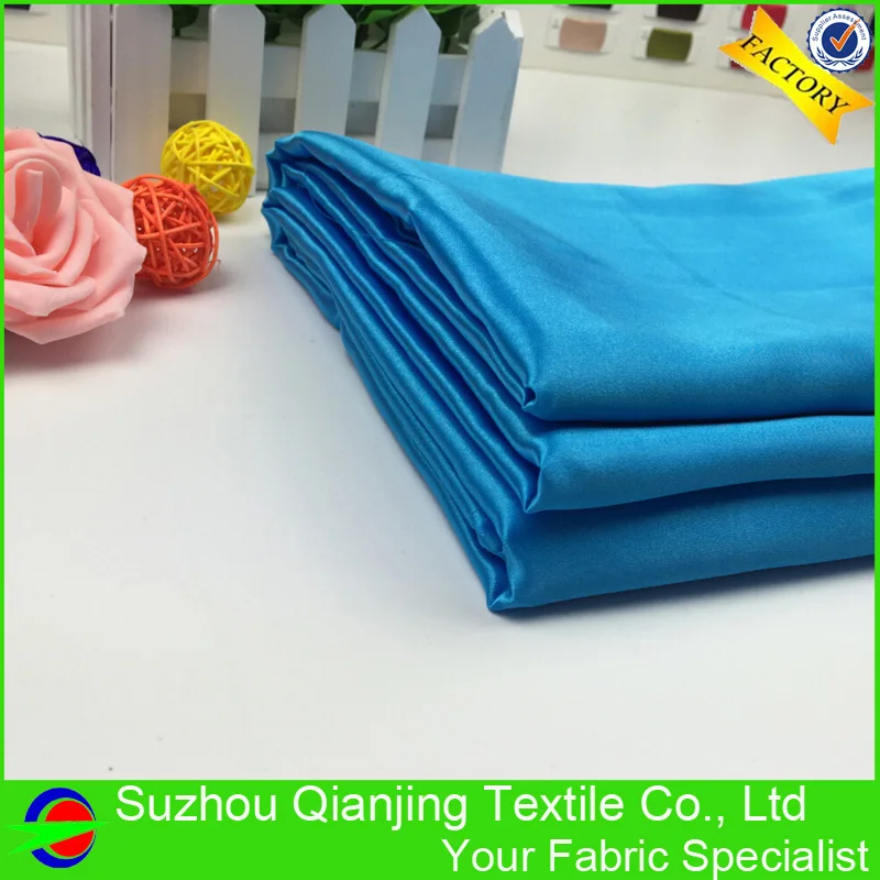 Блестящая гладкая мягкая кислота синяя полиэфирная атласная ткань высокого